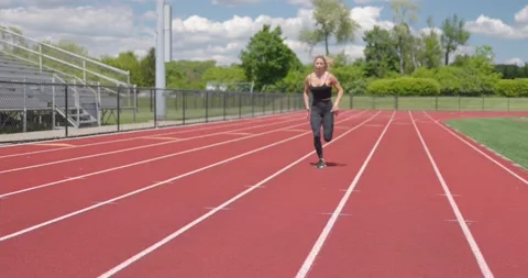 Beautiful Female Physical Trainer Working Out Exercising Running on Track 库存影片 154384601