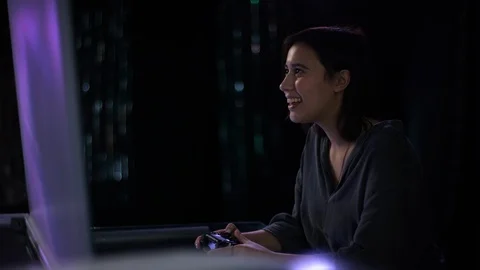 Beautiful female playing a console game in futuristic room Stock Footage 101196312