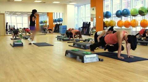 Beautiful female on the step board during exercise. Video stock 66473124