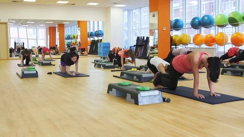 Beautiful female on the step board during exercise. Video stock 80647668