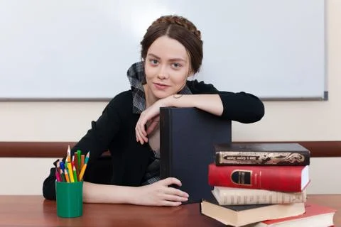 Beautiful female student with books Stock Photos