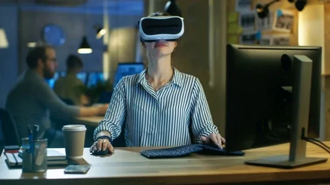 Beautiful Female Virtual Reality Engineer/ Developer Wearing VR Headset. Stock Footage 79443045