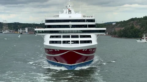 Beautiful ferry ship sailing through the sea, seagulls fly around Vídeo Stock 291992426