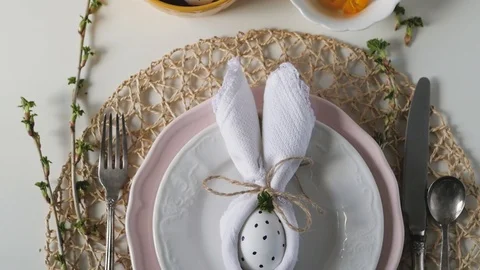 Beautiful festive Easter table setting with napkin Easter Bunny. Easter table Video stock 108715069
