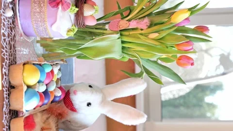 Beautiful festive served Easter table with decorations in dining room. Stock Footage 234412584