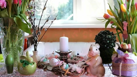 Beautiful festive served Easter table with decorations in dining room. Stock Footage 234413367