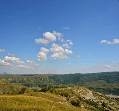 Beautiful fields on the slopes of the mountains in summer Stock Photos