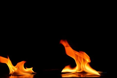 Beautiful fire flames on a black background. Stock Photos