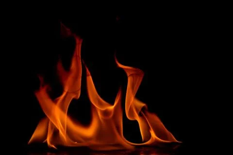 Beautiful fire flames on a black background. Stock Photos