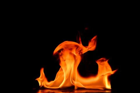 Beautiful fire flames on a black background. Stock Photos