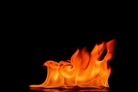 Beautiful fire flames on a black background. Stock Photos