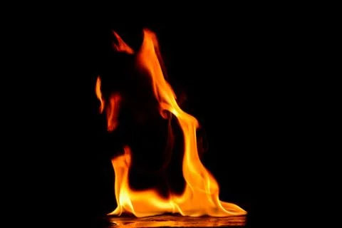 Beautiful fire flames on a black background. Stock Photos
