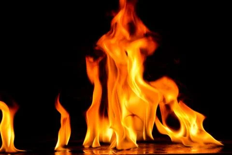 Beautiful fire flames on a black background. Stock Photos