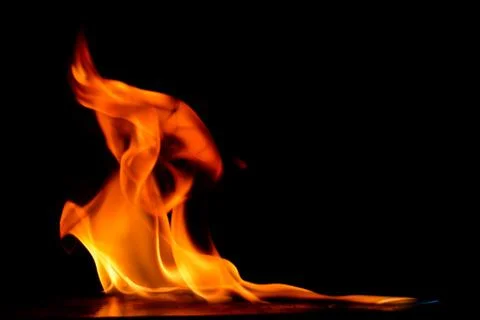 Beautiful fire flames on a black background. Stock Photos