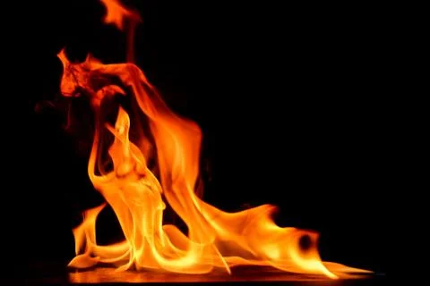 Beautiful fire flames on a black background. Stock Photos