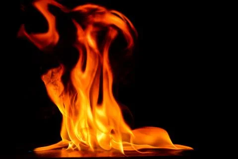 Beautiful fire flames on a black background. Stock Photos