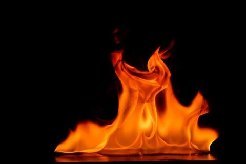 Beautiful fire flames on a black background. Stock Photos