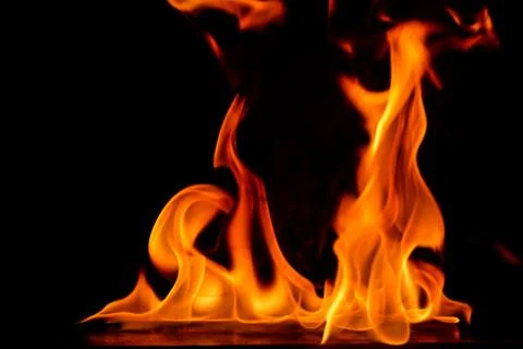 Beautiful fire flames on a black background. Stock Photos