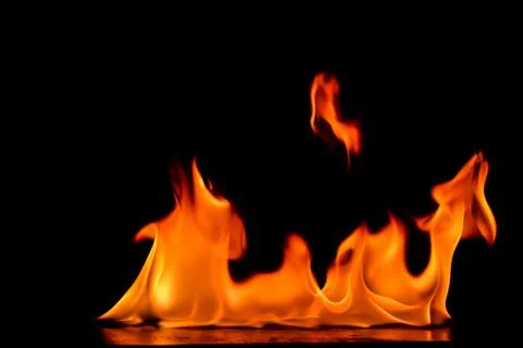Beautiful fire flames on a black background. Stock Photos