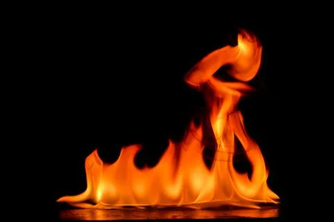 Beautiful fire flames on a black background. Stock Photos