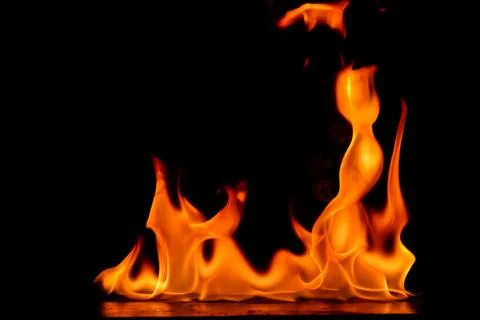 Beautiful fire flames on a black background. Stock Photos