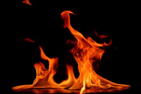 Beautiful fire flames on a black background. Stock Photos