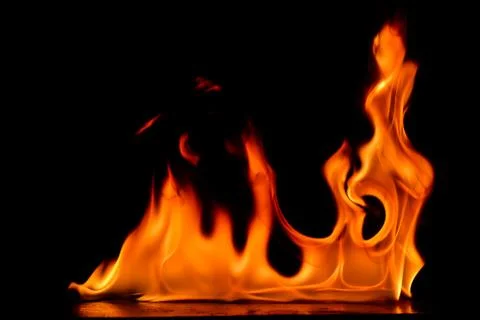 Beautiful fire flames on a black background. Stock Photos
