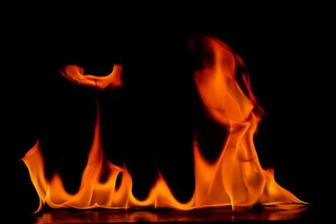 Beautiful fire flames on a black background. Stock Photos