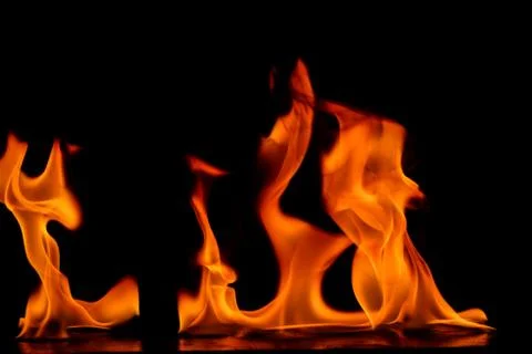 Beautiful fire flames on a black background. Stock Photos