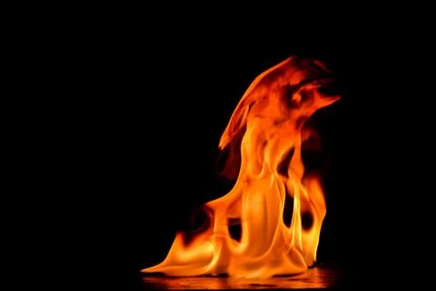 Beautiful fire flames on a black background. Stock Photos