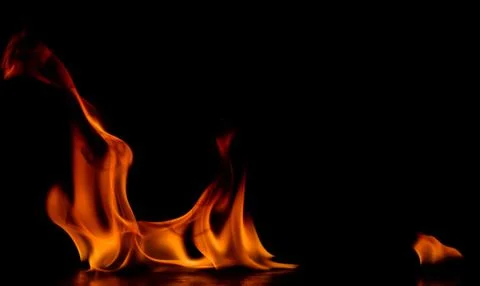 Beautiful fire flames on a black background. Stock Photos
