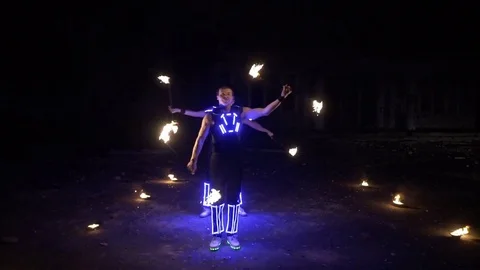 Beautiful fire show in the performance of two guys Stock Footage 82374031