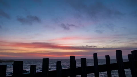 Beautiful fire sky ocean sunset with wooden fence - timelapse Stock-Footage 220024955