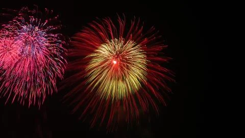 Beautiful firework display on sky at night Stock Photos