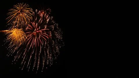 Beautiful firework display on sky at night Stock Photos