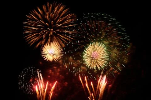 Beautiful firework display on sky at night Stock Photos
