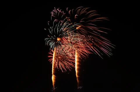 Beautiful firework display on sky at night Stock Photos