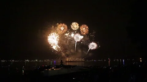 Beautiful firework ocean front crowd people Stock Footage 79498925