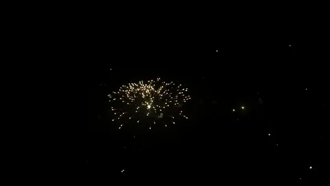 Beautiful fireworks display exploding against black sky Stock Footage 100520197
