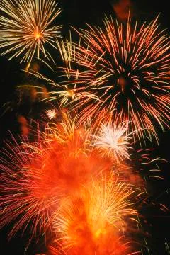 Beautiful fireworks display lights up the night time sky Stock Photos