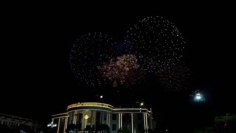 Beautiful Fireworks Exploding Over City Buildings at Stock Footage 345962580