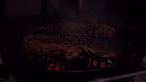 Beautiful flame burning a single steak at a barbecue Stock-Footage 74111631
