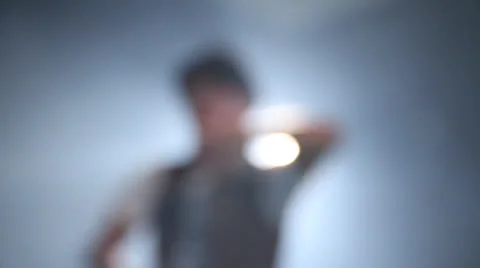 A beautiful flare rack focus boy sings and dancing of his own Stockbeeldmateriaal 22823769