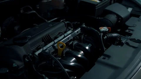 Beautiful flashes of light on a car with an open hood Stock Footage 102664548