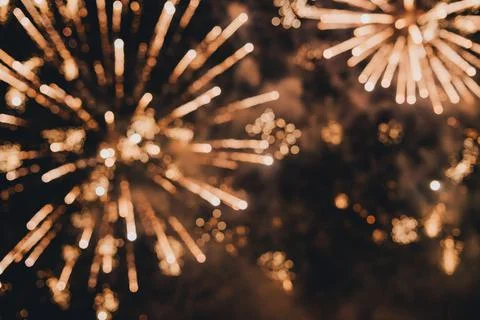 A beautiful flicker of fireworks. Selective focus. Blurry photo of fireworks. Stock Photos