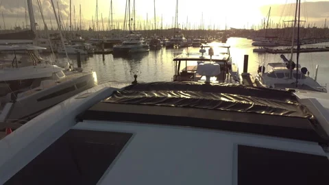 Beautiful flight between yachts at sunset Stock Footage 165978164