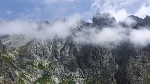 Beautiful flight with the Clouds at peaks in High Tatras Mountains in Slovakia Stock Footage 125995456
