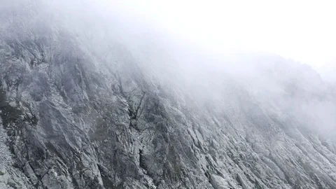 Beautiful flight in the Clouds at peaks in High Tatras Mountains in Slovakia Video stock 125996153