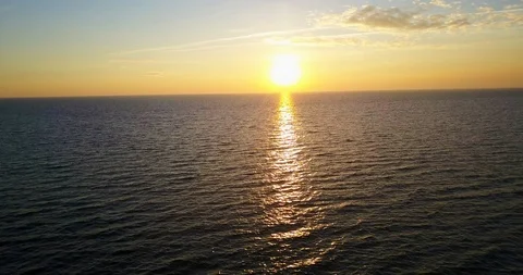 Beautiful flight over the black sunset sea Stock Footage 96536843