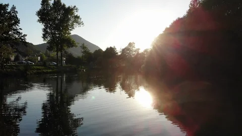 Beautiful flight over the river during sunset Stock Footage 114439590